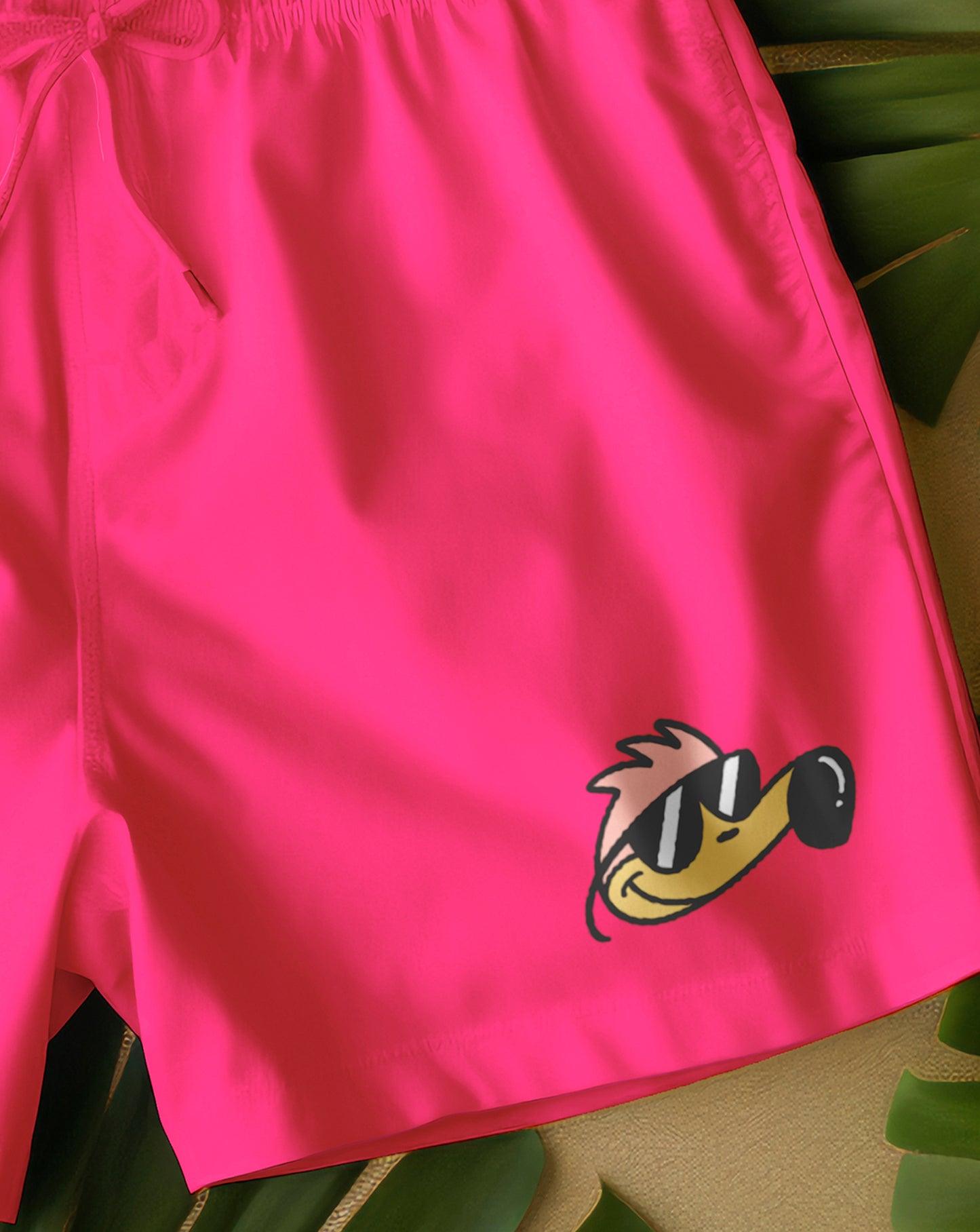 Bañador tipo boxer para niños en rosa fluor y estampado de flipi